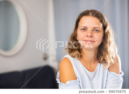 Girl dressed tee-shirt and tight shorts in at room 99070870