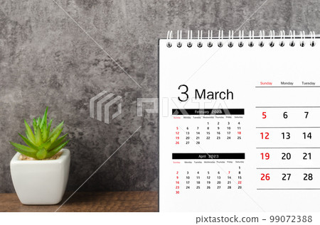 The March 2023 Monthly desk calendar for 2023 on wooden background. The March 2023 Monthly desk calendar for 2023 on wooden background. 99072388