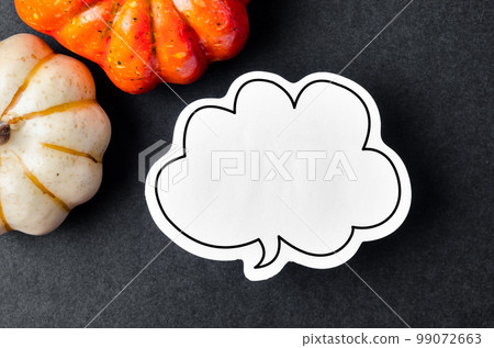 The blank speech bubble and pumpkins on black colour background for your text or message. The blank speech bubble and pumpkins on black colour background for your text or message. 99072663