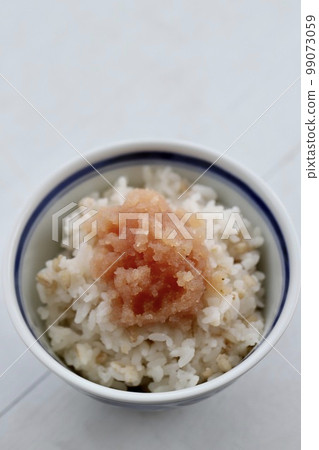 Uncolored cod roe served on rice in a bowl Uncolored cod roe served on rice in a bowl 99073059