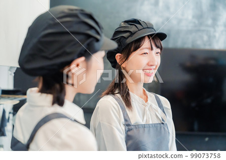 Friendly cafe staff Friendly cafe staff 99073758
