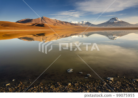 Salt lake Lejia reflection, idyllic volcanic landscape at Sunset, Atacama, Chile 99075955