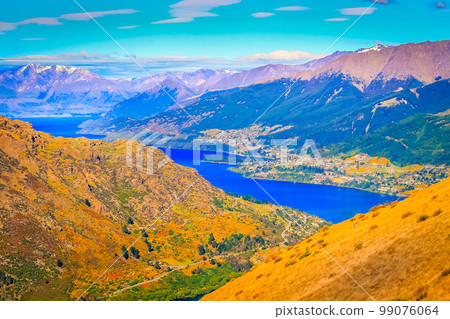 Above Queenstown and Lake Wakatipu in south Island, New Zealand at sunset Above Queenstown and Lake Wakatipu in south Island, New Zealand at sunset 99076064