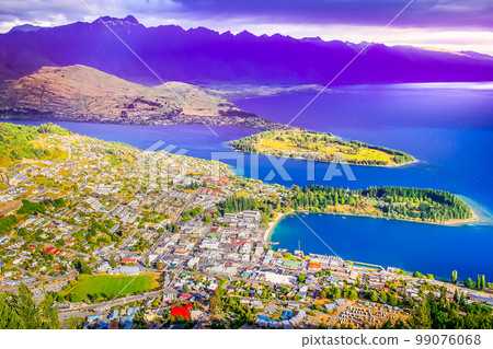 Above Queenstown and Lake Wakatipu in south Island, New Zealand at sunset Above Queenstown and Lake Wakatipu in south Island, New Zealand at sunset 99076068