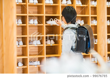 Elementary school boy going to school 99076785