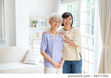 Senior woman relaxing in the living room 99077366