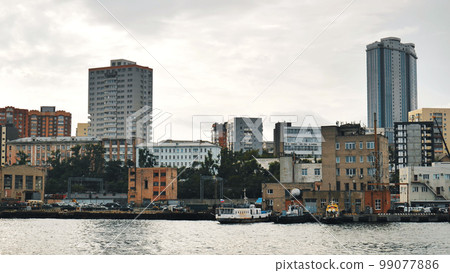 Panorama of the Russian city of Vladivstok. View from the moving ferry. 99077886