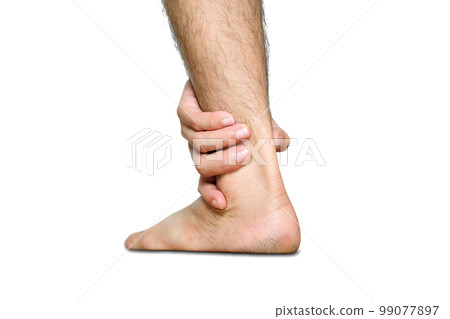 Ankle Pain man sitting on wooden background holding her feet. Health concept. 99077897