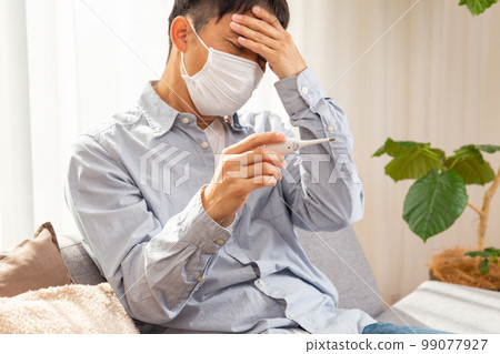 Men who measure body temperature 99077927