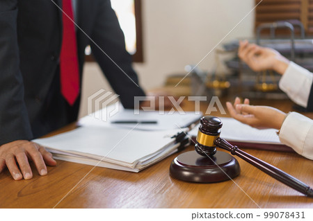 Legal and justice concept, Female lawyer shows contract to explains and consults with senior lawyer 99078431