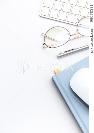 Keyboard, computer mouse and notebook with pen on white office desk Keyboard, computer mouse and notebook with pen on white office desk 99078551