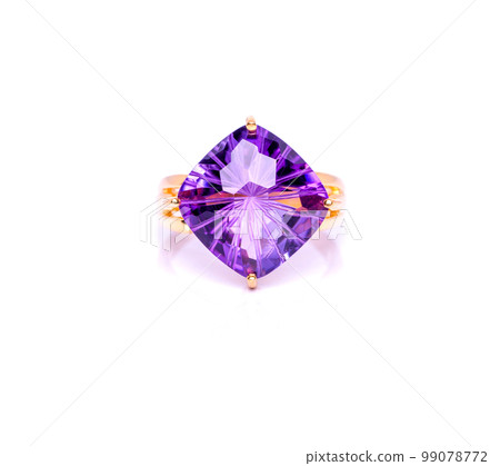 Amethyst Jewel or gems ring on white background with reflection. Collection of natural gemstones accessories. Studio shot 99078772
