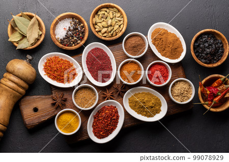 Various dried spices in small bowls Various dried spices in small bowls 99078929