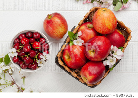 Ripe red apples and cherry 99079183