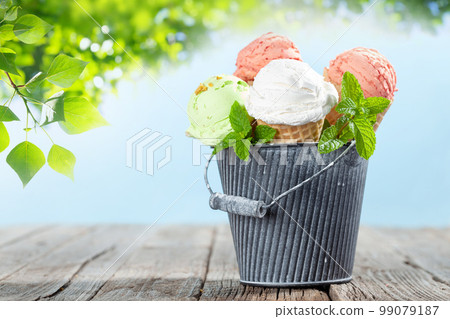 Various ice cream in waffle cones 99079187