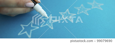 Person draws five stars in the recommendations with white felt-tip pen reviews 99079690
