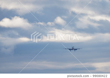 Plane about to land Clouds 99080422