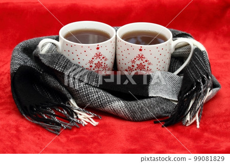Winter concept with tea for two and a scarf 99081829