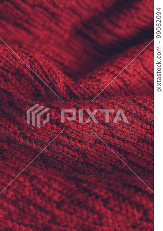 Beautiful knitted texture of red sweater. Close up background 99082094