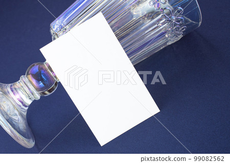Business card mock-up on opalescent wine glass background Business card mock-up on opalescent wine glass background 99082562