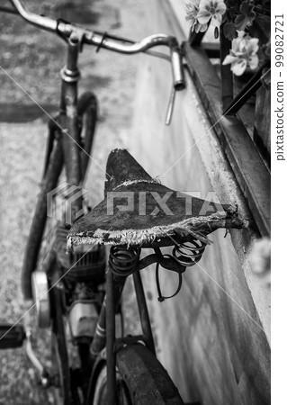Old bicycle abandoned on the street Old bicycle abandoned on the street 99082721