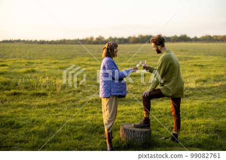 Couple hang out on nature during sunset Couple hang out on nature during sunset 99082761