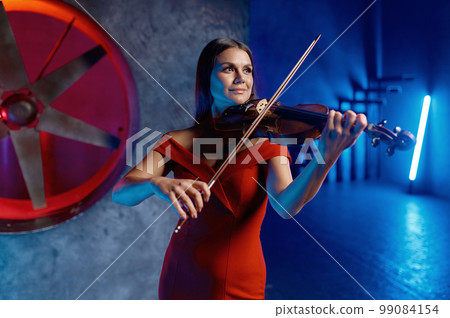 Closeup portrait of gorgeous elegant woman playing violin 99084154
