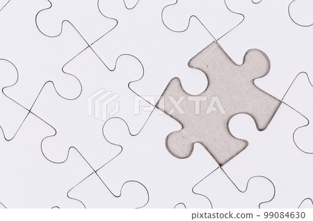 white puzzle jigsaw close up 99084630