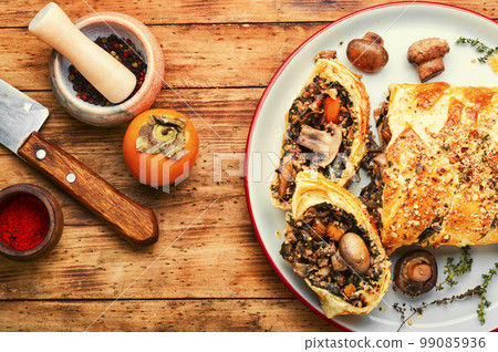 Homemade savoury mushroom pie with and persimmon 99085936