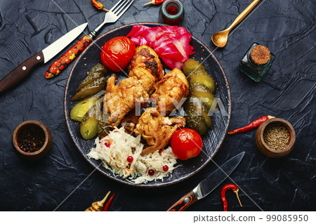 Roasted chicken meat and marinated vegetables Roasted chicken meat and marinated vegetables 99085950