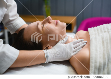 Cosmetology face and neckline massage in salon Cosmetology face and neckline massage in salon 99086199