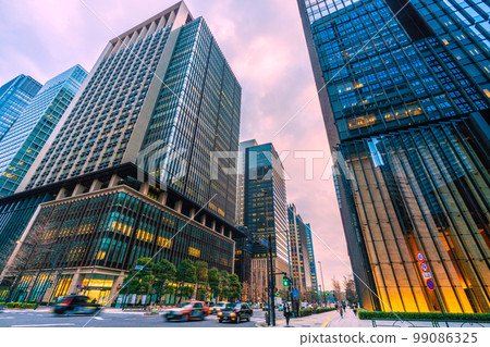 Tokyo cityscape in Japan View of office buildings in the evening from the intersection in front of Otemachi station Tokyo cityscape in Japan View of office buildings in the evening from the intersection in front of Otemachi station 99086325