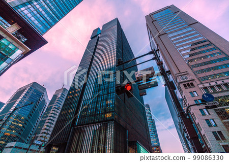 Tokyo cityscape in Japan View of office buildings in the evening from the intersection in front of Otemachi station Tokyo cityscape in Japan View of office buildings in the evening from the intersection in front of Otemachi station 99086330