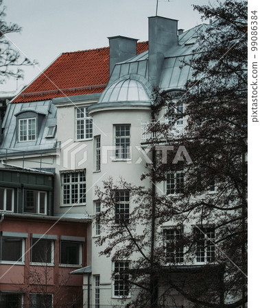 Old white stone house in Nykoping sweden 99086384