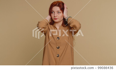 Annoyed irritated young woman covering ears, gesturing No avoiding advice ignoring noise loud voices Annoyed irritated young woman covering ears, gesturing No avoiding advice ignoring noise loud voices 99086436