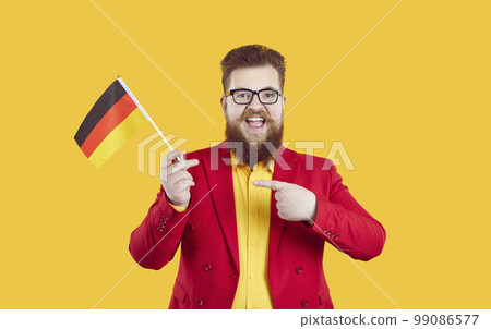 Happy bearded fat man with German flag is very happy about studying German language 99086577