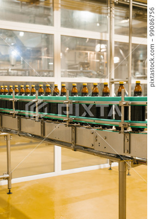 Conveyor at the brewery for bottling beer 99086756