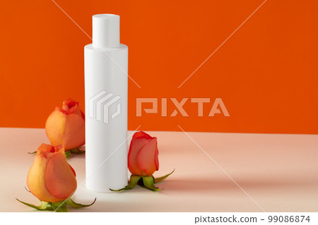 Cosmetic bottles with rose petals, copy space 99086874