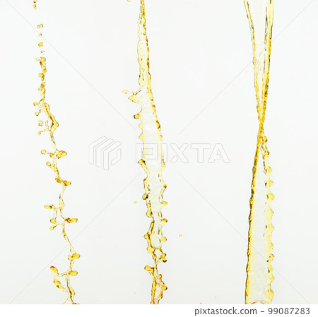Orange, lemon juice or oil lubricant splash, liquid gold yellow drink drops. Fruit beverage water elements in line form . Fresh splashing and flowing jets, white background isolated freeze motion Orange, lemon juice or oil lubricant splash, liquid gold yellow drink drops. Fruit beverage water elements in line form . Fresh splashing and flowing jets, white background isolated freeze motion 99087283