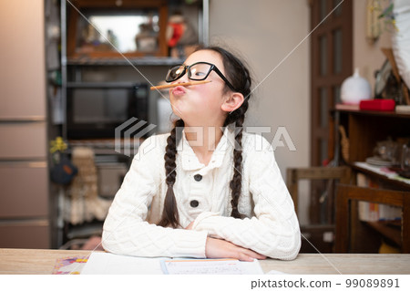 girl with glasses tired of studying 99089891