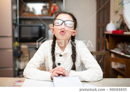 girl with glasses tired of studying girl with glasses tired of studying 99089895