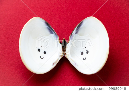Hina festival image. A puppet-style face painted on the inside of a clam shell that is regarded as a symbol of marital perfection. Hina festival image. A puppet-style face painted on the inside of a clam shell that is regarded as a symbol of marital perfection. 99089946