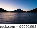 Mount Fuji at sunrise seen from frozen Lake Shoji 99091698
