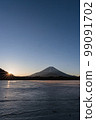 Mount Fuji at sunrise seen from frozen Lake Shoji 99091702