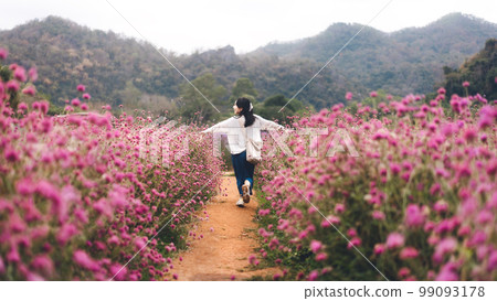 Rear view asian travel woman running in flower blossom nature park field on spring or summer Rear view asian travel woman running in flower blossom nature park field on spring or summer 99093178