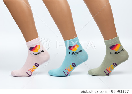 Socks on a white background. Socks on the leg. 99093377