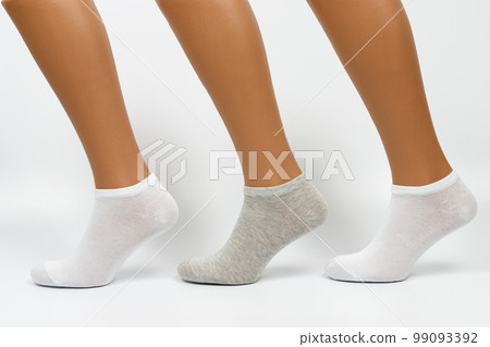 Socks on a white background. Socks on the leg. 99093392