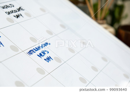 INTERNATIONAL MENS DAY on calendar to remind important event appointment Monthly PLANNER. Magnetic board with the days of the month. Place to enter important matters schedule. Concept for business INTERNATIONAL MENS DAY on calendar to remind important event appointment Monthly PLANNER. Magnetic board with the days of the month. Place to enter important matters schedule. Concept for business 99093640