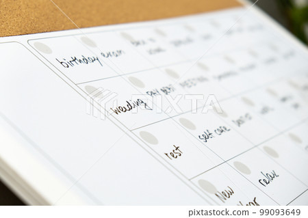 Monthly PLANNER filled with appointments and plans for next month. Busy month schedule Magnetic board with the days of the month. Place to enter important matters schedule. Concept for business 99093649