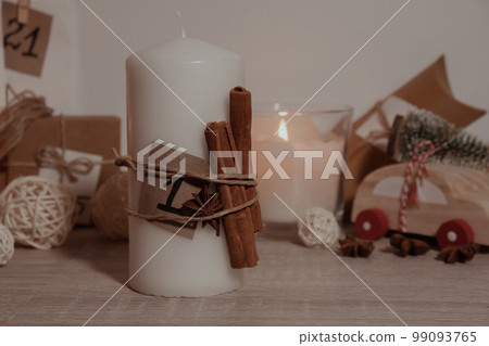 Candle with advent calendar Traditional Burning Christmas Wax Candles with numbers counting down for Christmas. Beautiful Advent At Home. Festive Candlelight And Dark Background 99093765